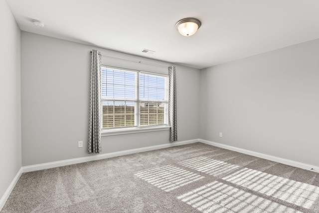 empty room with carpet flooring