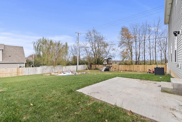 view of yard with a playground and a patio