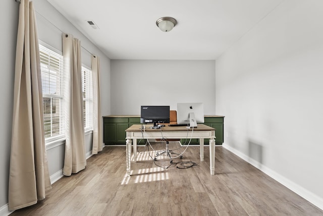 office space with light wood-type flooring