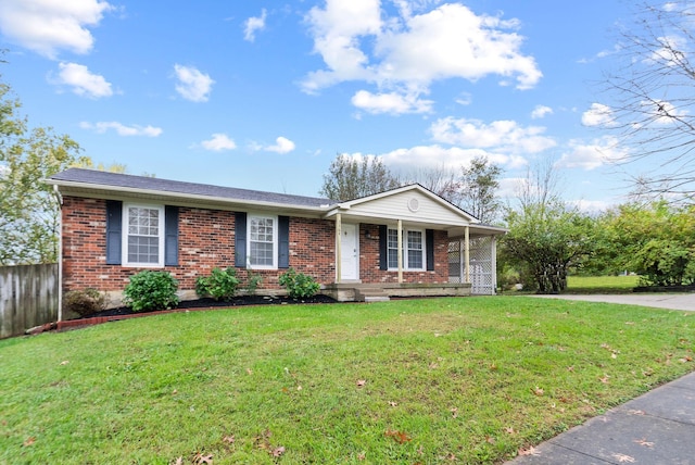 ranch-style house with covered porch and a front yard