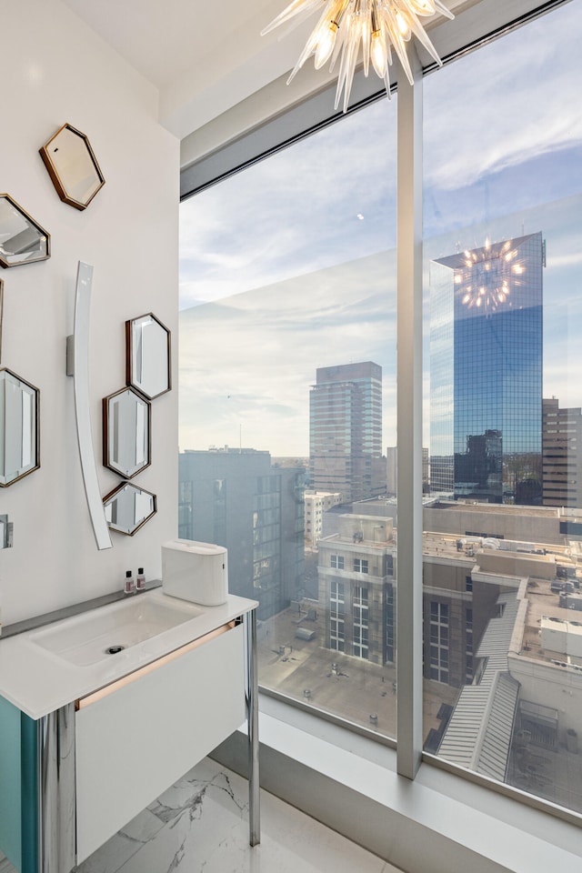 103 S Limestone St Unit 1020, Lexington, KY 40507 - bathroom with marble finish floors, a city view, healthy amount of natural light, and vanity