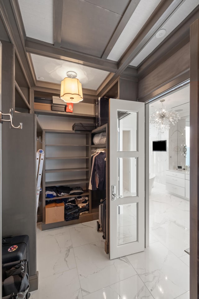 103 S Limestone St Unit 1020, Lexington, KY 40507 - hall with marble look tiles and a chandelier