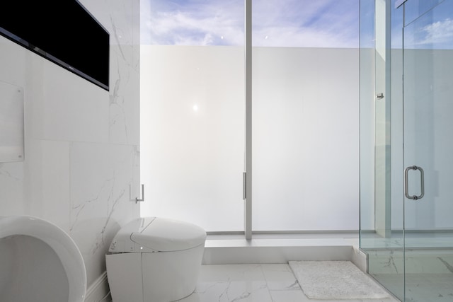 103 S Limestone St Unit 1020, Lexington, KY 40507 - bathroom with marble look tile flooring and a shower stall