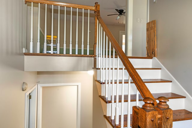 stairs with ceiling fan