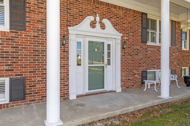 entrance to property featuring a porch