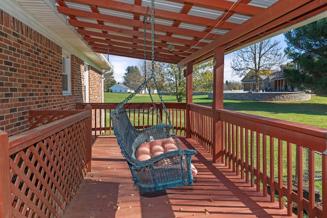 wooden deck featuring a yard