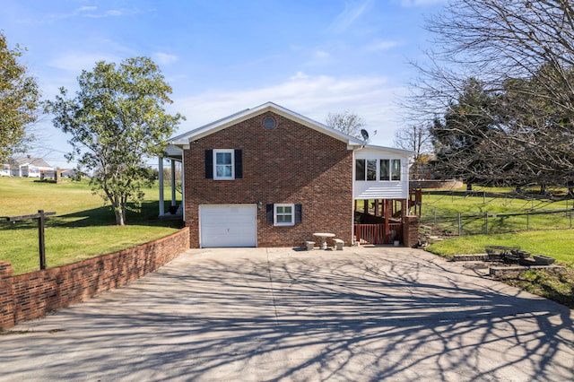 view of side of property featuring a yard and a garage