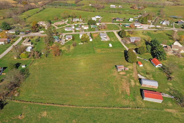 birds eye view of property with a rural view