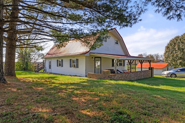 view of side of property with a porch and a yard