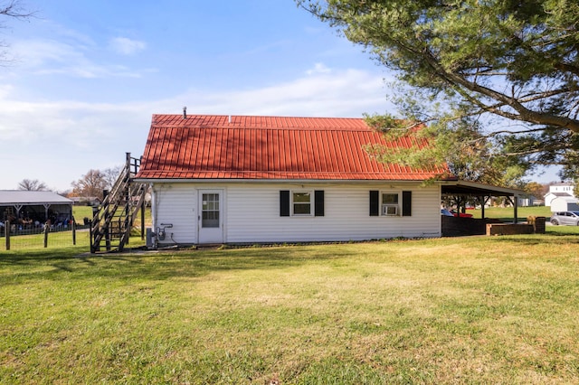 back of house featuring a lawn