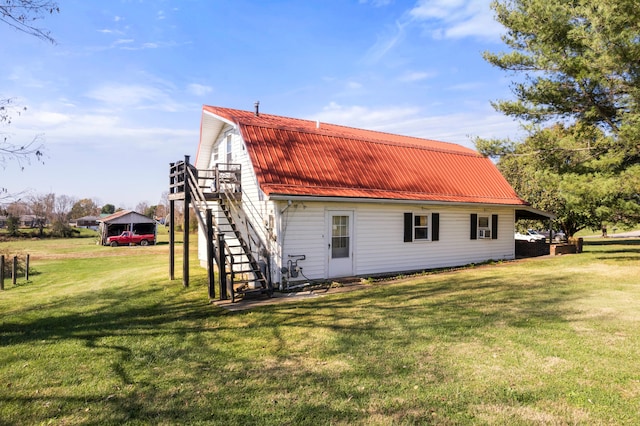 view of home's exterior featuring a lawn