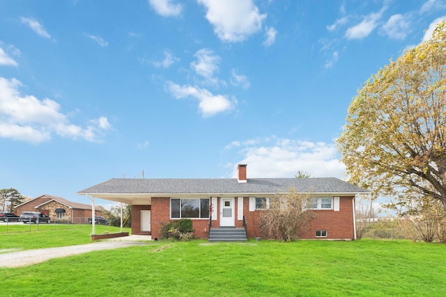 ranch-style home with a front yard and a carport