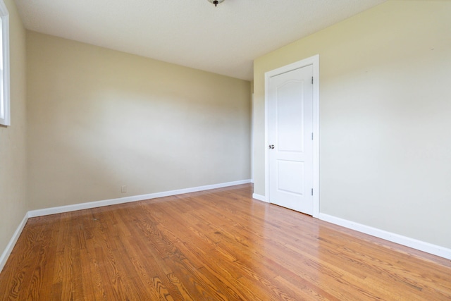 unfurnished room featuring hardwood / wood-style floors