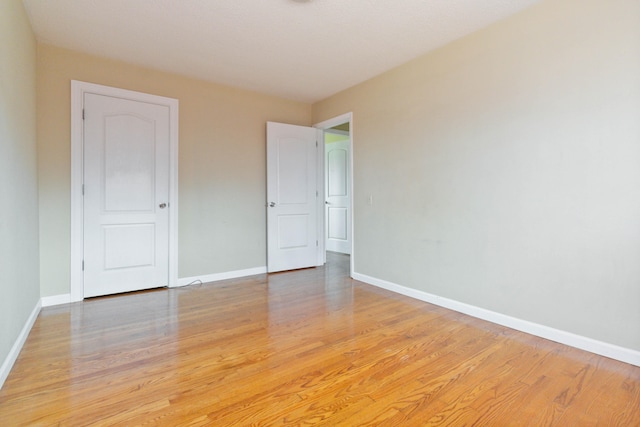 unfurnished room featuring wood-type flooring