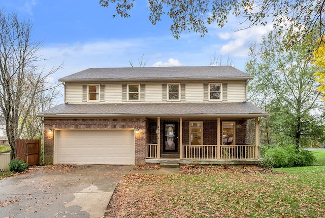 view of front of house featuring covered porch and a garage