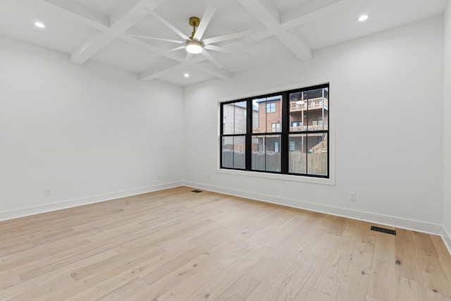 empty room with ceiling fan, beamed ceiling, light hardwood / wood-style floors, and coffered ceiling