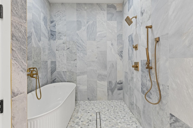 bathroom featuring separate shower and tub and tile walls