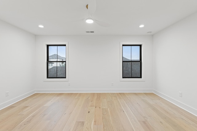 spare room with ceiling fan and light hardwood / wood-style floors