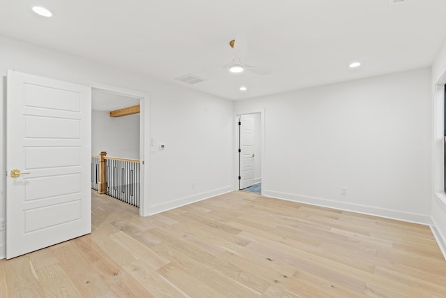 unfurnished room featuring ceiling fan and light hardwood / wood-style flooring