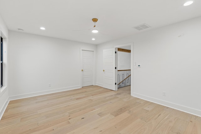 spare room with ceiling fan and light hardwood / wood-style flooring