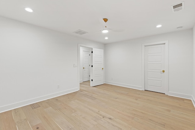 spare room featuring ceiling fan and light hardwood / wood-style floors