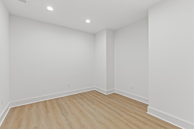 spare room featuring light hardwood / wood-style floors