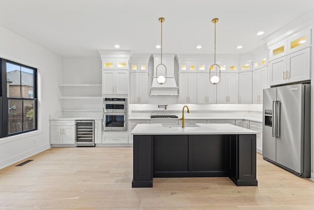 kitchen featuring custom exhaust hood, beverage cooler, white cabinetry, and appliances with stainless steel finishes