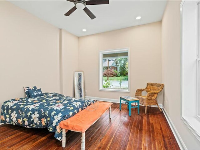 bedroom with hardwood / wood-style floors and ceiling fan