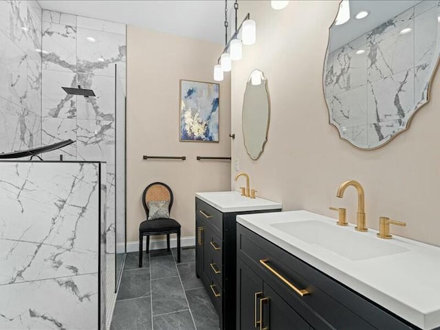 bathroom featuring vanity and tiled shower