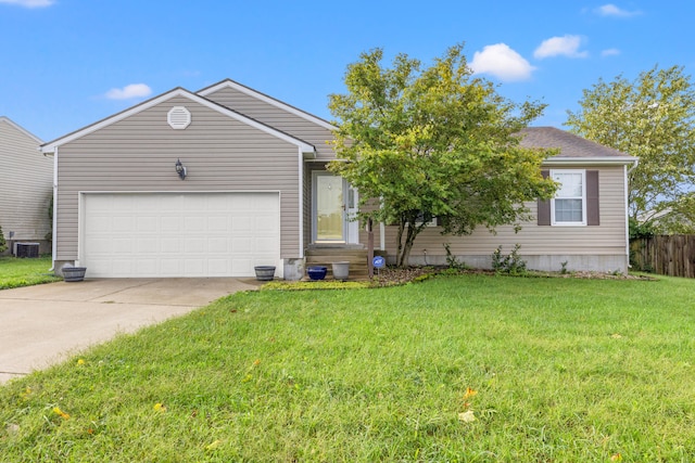 view of front of property featuring cooling unit, a garage, and a front lawn