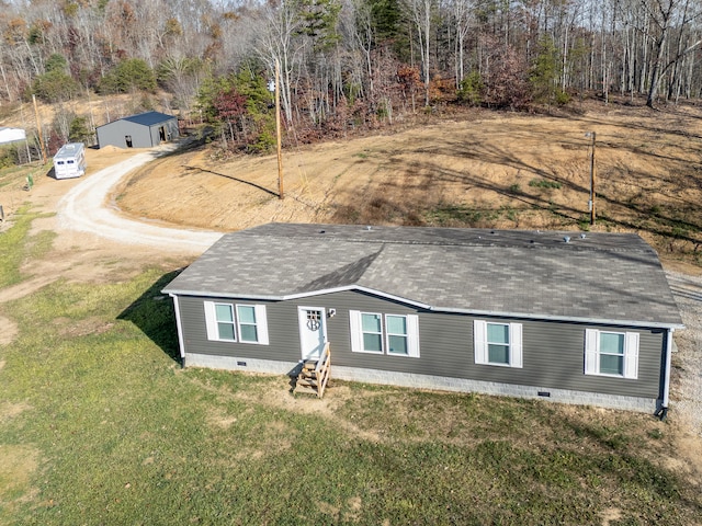 rear view of property with a lawn