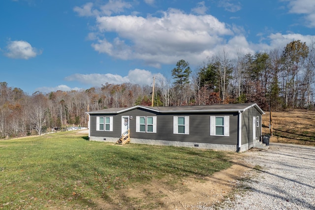 manufactured / mobile home with a front lawn