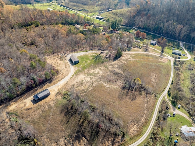 birds eye view of property with a rural view