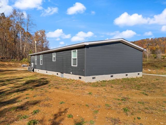 view of home's exterior featuring central AC unit