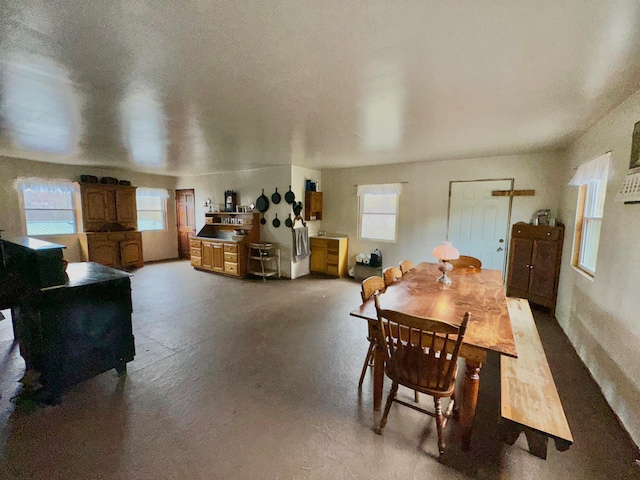 dining room featuring a textured ceiling