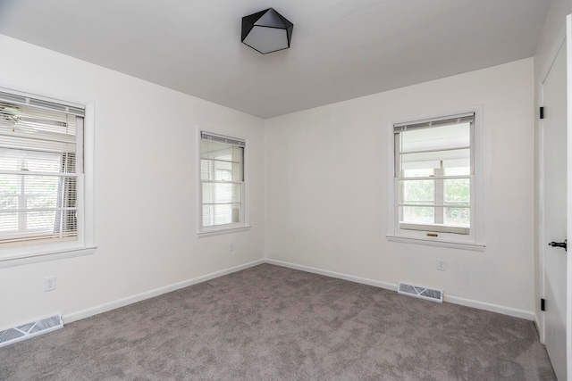 spare room with light carpet