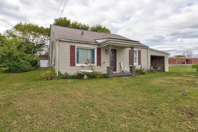 view of front of house with a front yard and a garage