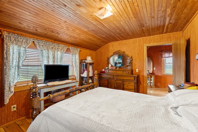 bedroom with wooden walls, wood ceiling, and light wood-type flooring