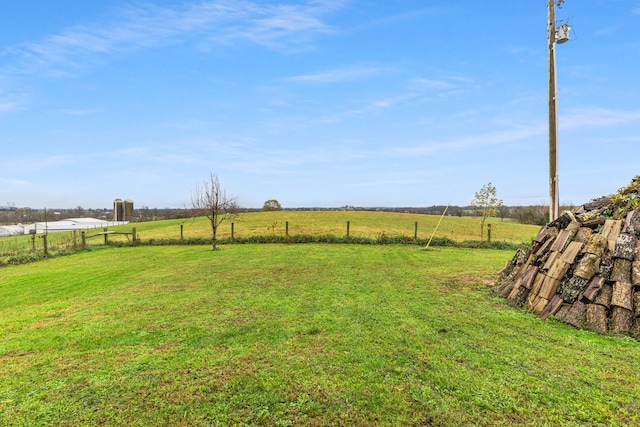 view of yard with a rural view