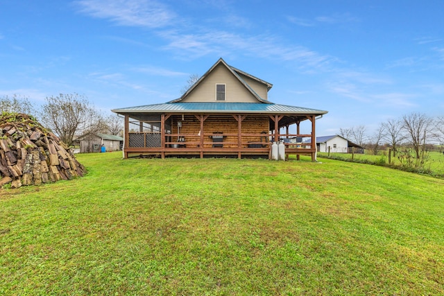 rear view of house with a lawn