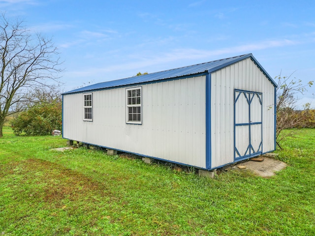 view of outdoor structure with a lawn