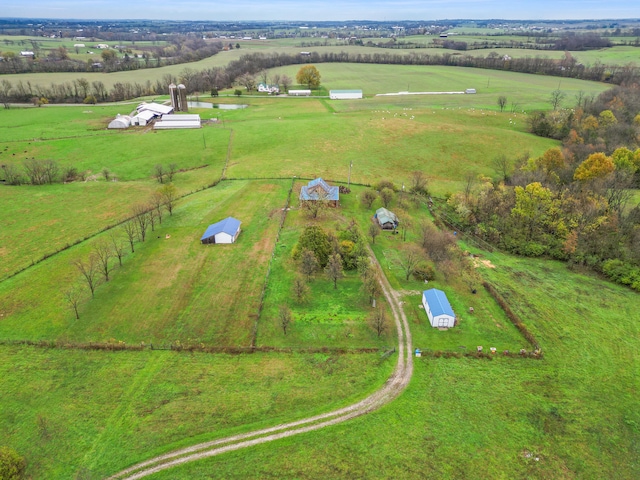 birds eye view of property with a rural view