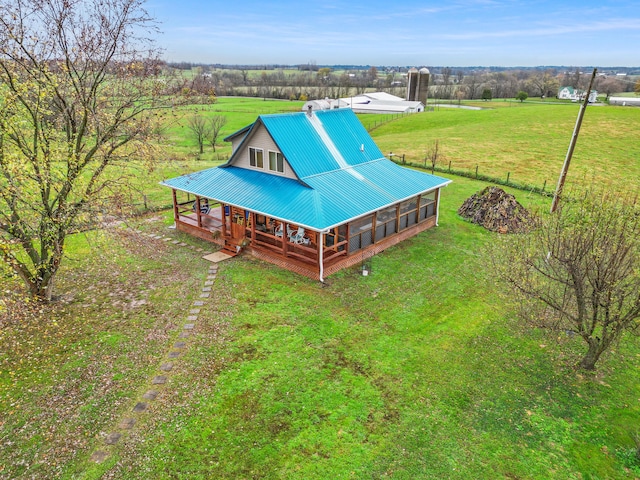 birds eye view of property featuring a rural view