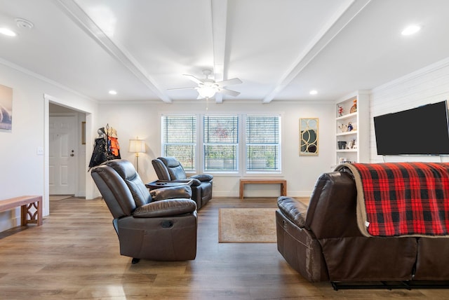 living room with beamed ceiling, light hardwood / wood-style flooring, ceiling fan, and ornamental molding