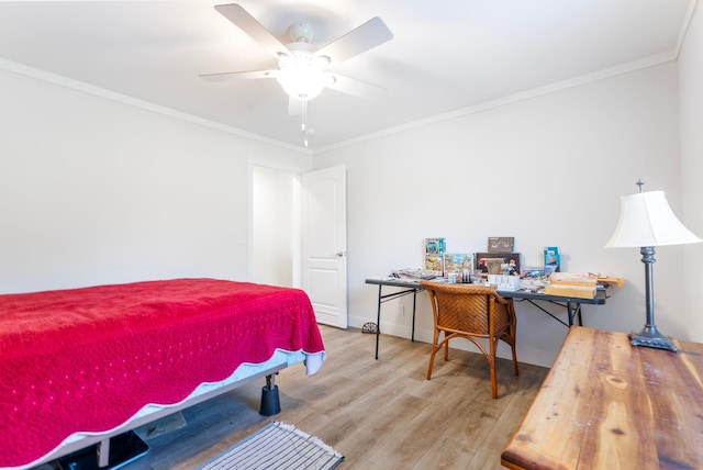 bedroom featuring wood-type flooring, ceiling fan, and crown molding