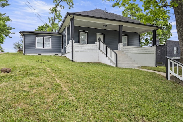 view of front of home with covered porch and a front lawn