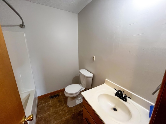 full bathroom featuring a textured ceiling, vanity, toilet, and tub / shower combination