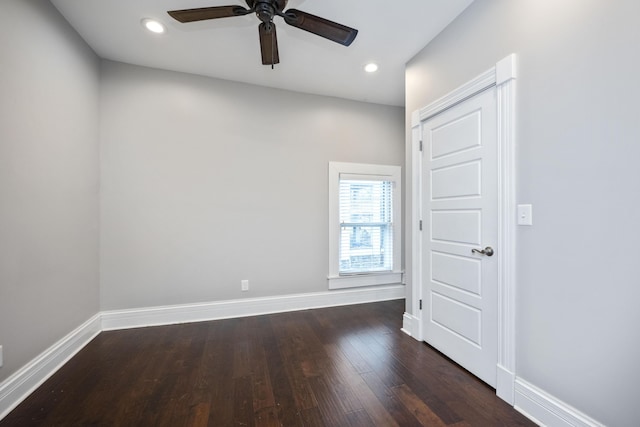 empty room with dark wood finished floors, recessed lighting, baseboards, and ceiling fan