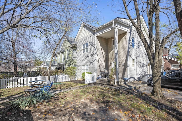 view of home's exterior with fence