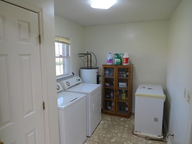 kitchen featuring light wood-type flooring, a textured ceiling, sink, washer / dryer, and black dishwasher